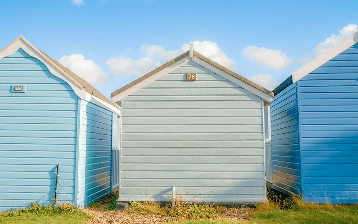 The same painted timber cladding after soft washing, with the staining gone and the paint undamaged